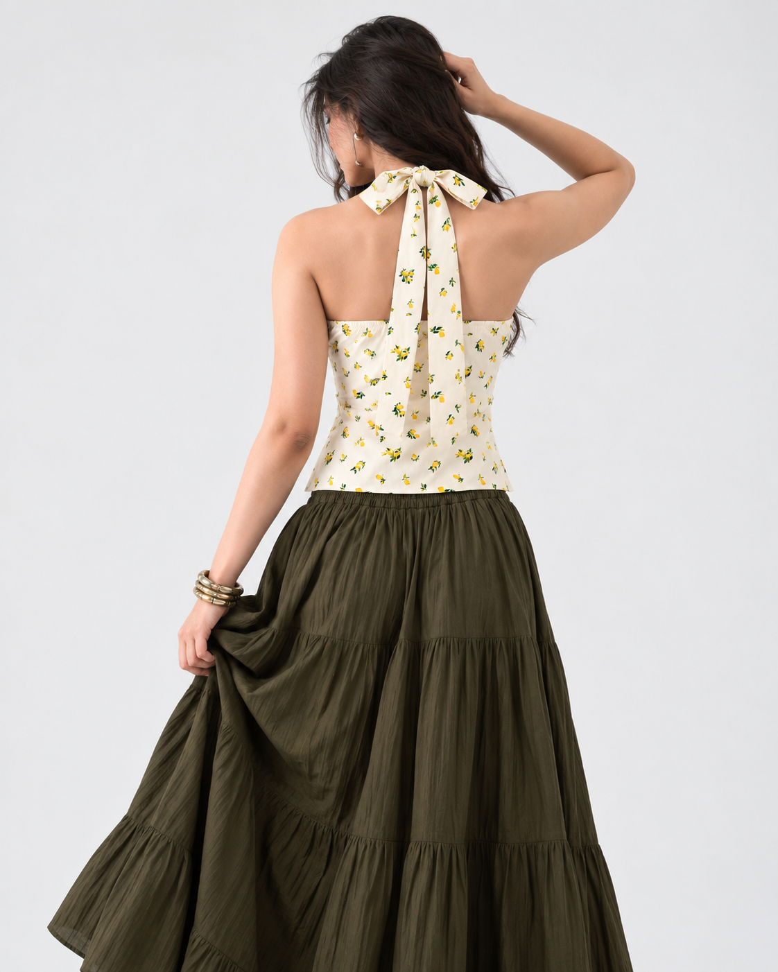 Cream yellow lemon print halter crop top on model back