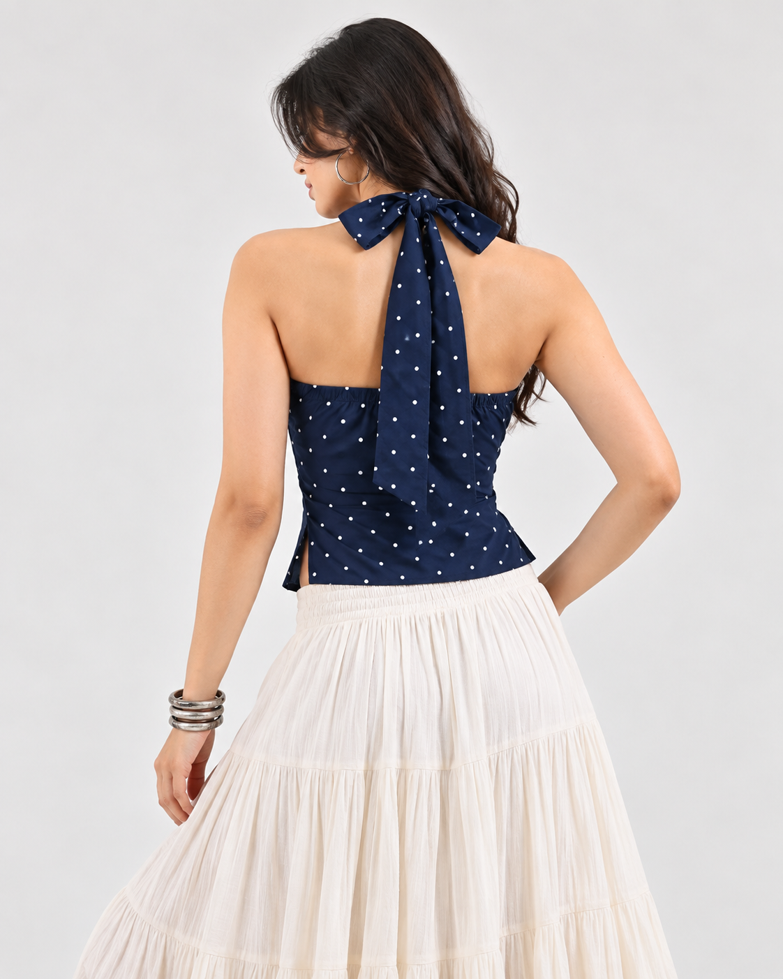 Navy blue white polka-dot halter crop top on model back