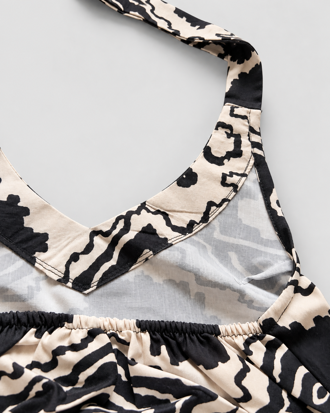 Cream black abstract halter crop top detail