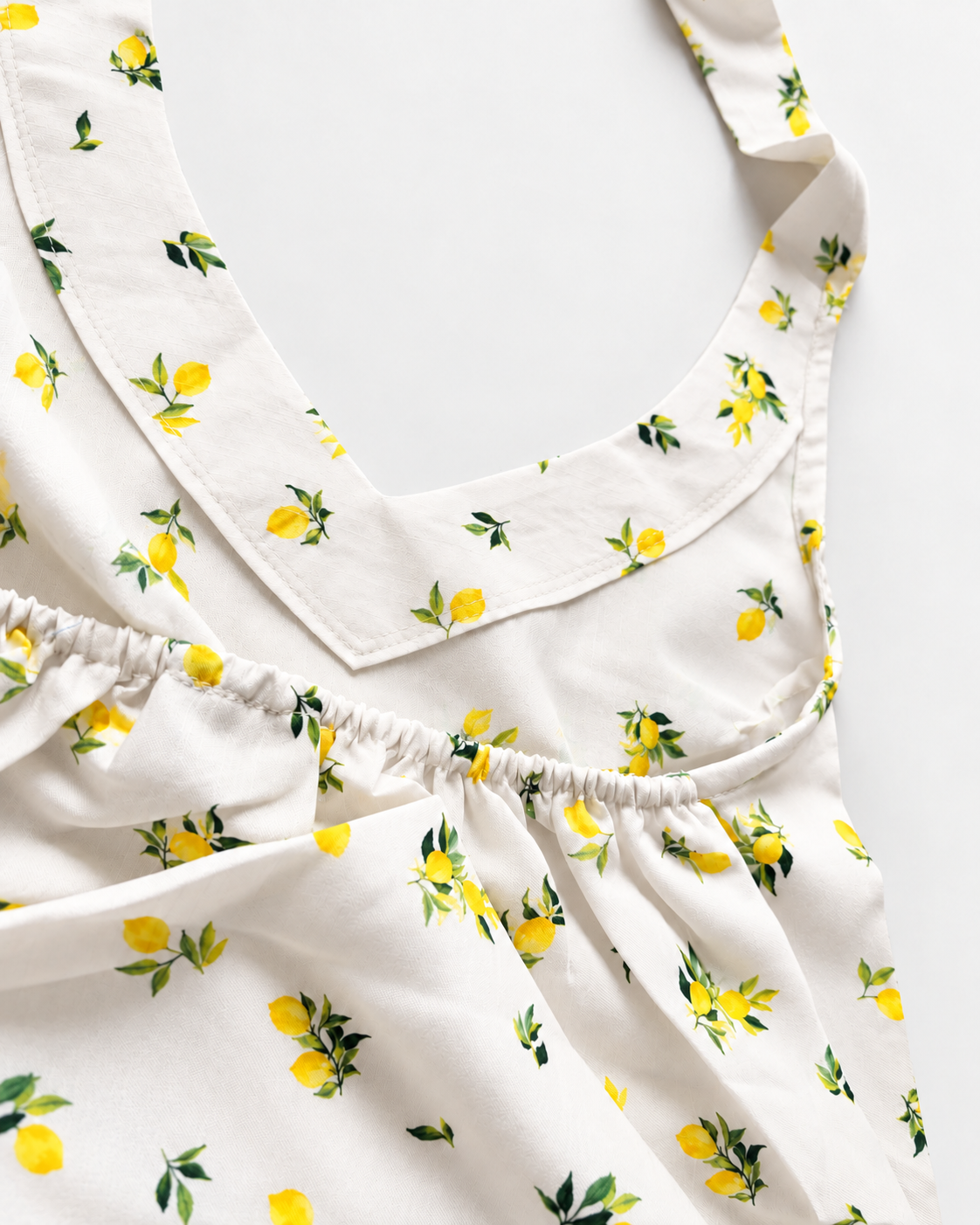 Cream yellow lemon print halter crop top detail