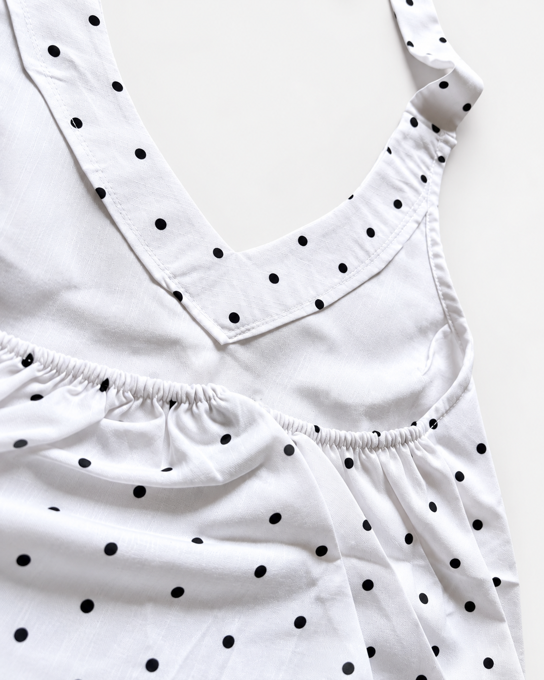 White black polka-dot halter crop top detail