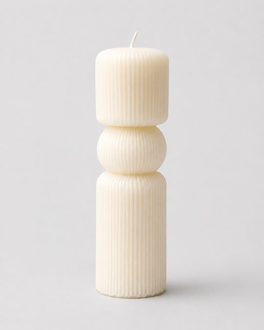 Grey Exim ribbed geometric sculptural pillar French Vanilla candle front view